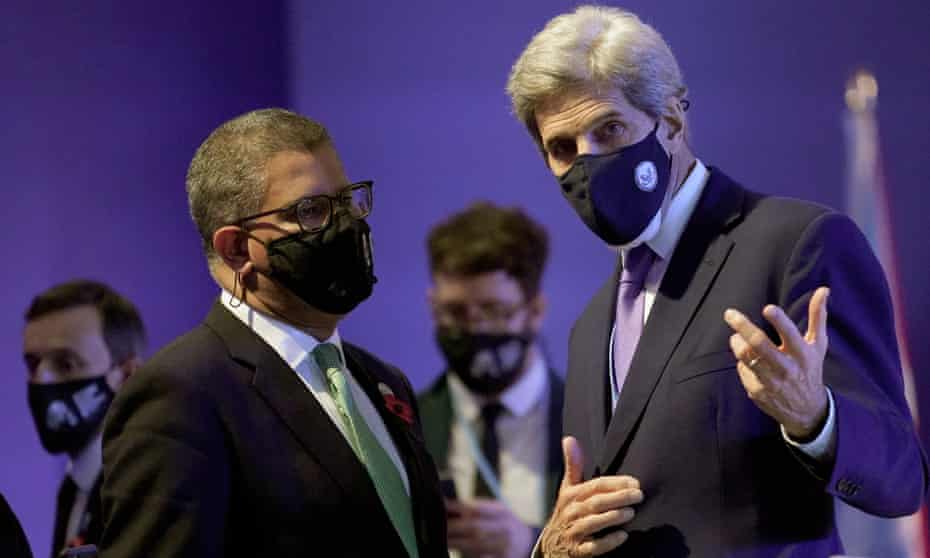 Alok Sharma, president of the Cop26 summit, left, talks to US climate envoy John Kerry.
