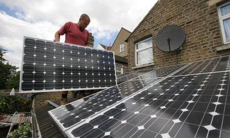 Solar panels being installed on the roof of a house in London