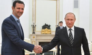 Vladimir Putin (right) shakes hands with Syria’s Bashar al-Assad in the Kremlin in October. 