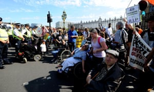 Protesters gather outside Westminster to demonstrate against disability benefit cuts.