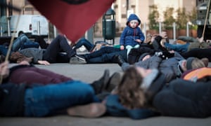 Climate protesters outside the EU parliament in Brussels demand it declares a climate emergency.