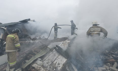 A view of the area after shelling in the city of Khartsyzsk, Russian controlled territory, on March 18, 2023. Firefighters work at the building hit by shelling. (Photo by Stringer/Anadolu Agency via Getty Images)