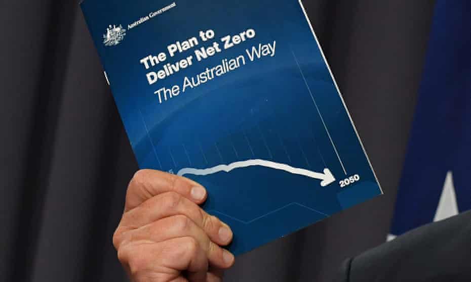 Scott Morrison holds his plan for net zero emissions