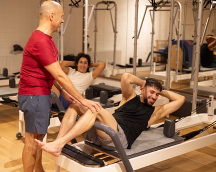 Sammy on a reformer pilates machine