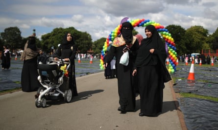 People make their way home after Eid prayers in Small Heath park