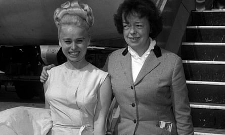 Joan Littlewood with Barbara Windsor in 1964, leaving Heathrow airport for the US.