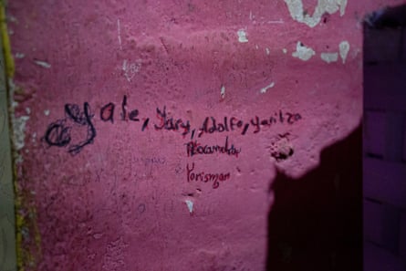 The names Yale (for Alexandra), Yary (for Carmen Yarismar), Adolfo and Yaritza are handwritten on a wall inside the Guedez García family home