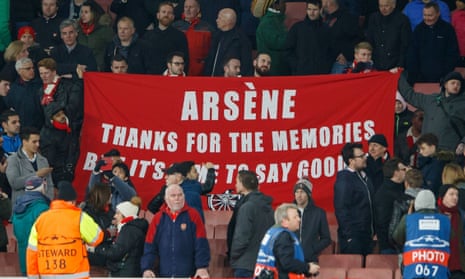 Arsenal fans hold up a banner at the 5-1 defeat to Bayern Munich