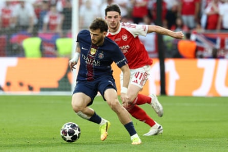 Khvicha Kvaratskhelia of PSG and Declan Rice of Arsenal compete for the ball during the 2025/2026 Champions League Final football match between Paris Saint Germain and Arsenal FC at Puskas Arena stadium in Budapest (Hungary), May 30th, 2026.