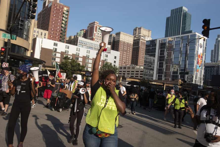 woman holds up megaphone