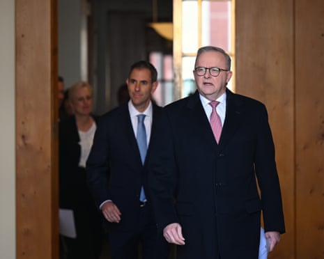 Anthony Albanese (donning a thick winter coat), Jim Chalmers and Katy Gallagher walk out of the prime minister’s office to confirm the agreement made with the Greens.