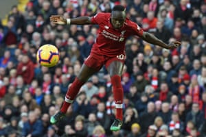 Liverpool’s striker Sadio Mane jumps to win a header against Bournemouth at Anfield. The Reds won the match 3-0 and stay top of the table.