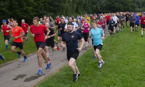 Runners in Andover, Hampshire, in July 2021. The scheme could reward activities such as Parkruns.