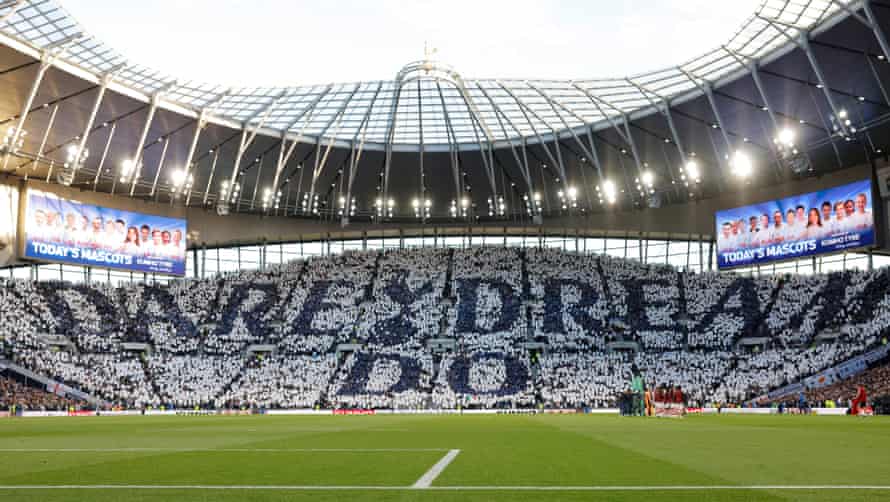 A general view inside the stadium as fans hold up pieces of fabric to display a message of ‘Dare Dream Do’.