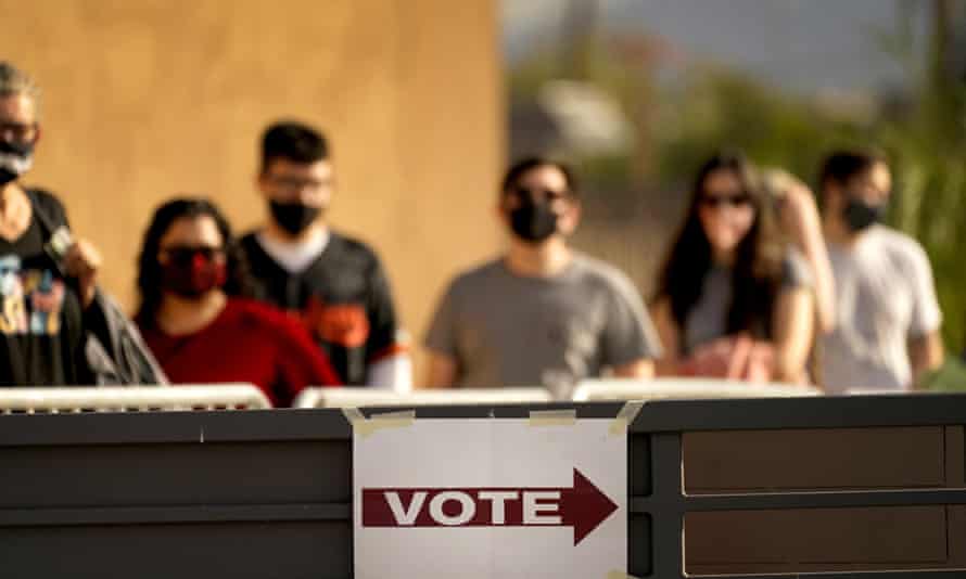 Voters stand in line outside a polling station on election day last year in Mesa, Arizona.