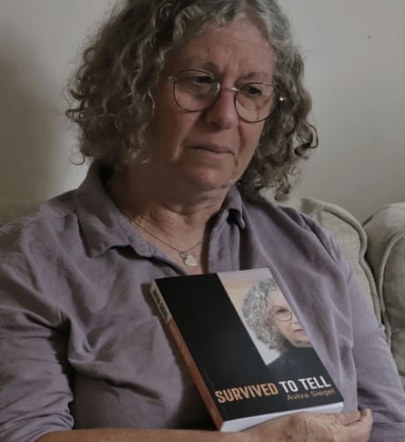 Aviva Siegel with her book, Survived to Tell
