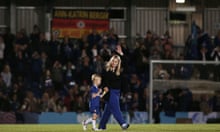 Head coach of Chelsea Emma Hayes waves at the fans with her son Harry during the Barclays FA Womens Super League game between Chelsea and Bristol City.
