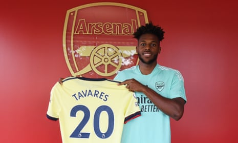 The left-back Nuno Tavares poses with his Arsenal shirt after signing from Benfica