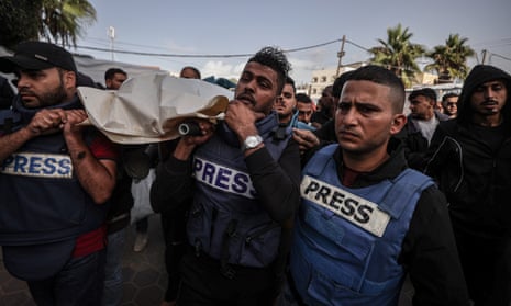 A funeral ceremony on Sunday for the Palestinian journalists Sari Mansour and Hasona Saliem, who were killed in Gaza.