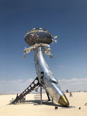 A sculptural airplane stands in the playa close to Black Rock City