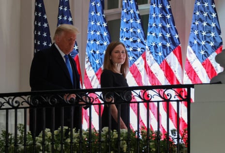 Judge Amy Coney appears at the White House with Donald Trump for the swearing-in ceremony.