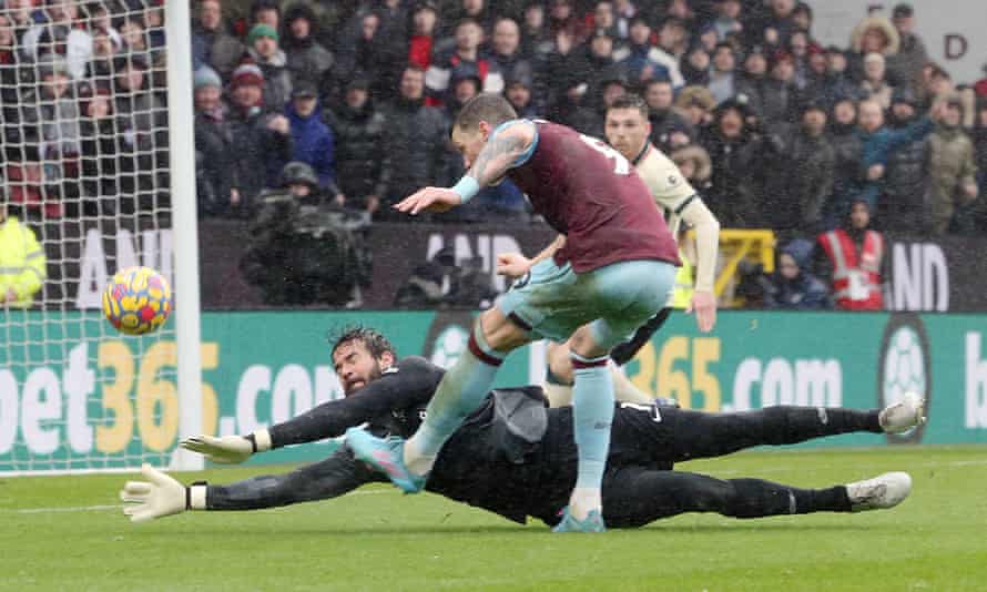 Burnley's Wout Weghorst is denied by the Liverpool goalkeeper, Alisson, at Turf Moor.