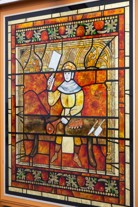Reddidh stained glass in Trieste shows a knighrt with a cleaver. A butcher-knight carving meat. Odd.