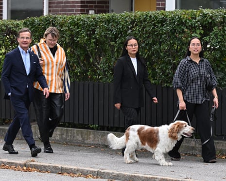 Sweden’s prime minister Ulf Kristersson (L), leader of the conservative Moderates, his wife, Birgitta Ed, two of their adopted daughters and family dog Winston arrive at a polling station to cast their ballots in Strangnas near Stockholm, Sweden.