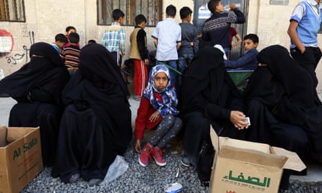 Food rations are distributed to families in Sana’a, Yemen, on 14 February. 