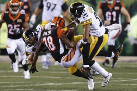 Cincinnati Bengals wide receiver A.J. Green (18) is tackled by Pittsburgh Steelers linebacker LJ Fort (54) and cornerback Artie Burns (25)