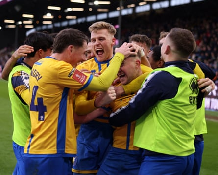 Burnley v Mansfield Town - Emirates FA Cup Fourth RoundBURNLEY, ENGLAND - FEBRUARY 14: Louis Reed of Mansfield Town celebrates scoring his team's second goal with Will Evans and teammates during the Emirates FA Cup Fourth Round match between Burnley and Mansfield Town on February 14, 2026 in Burnley, England. (Photo by George Wood/Getty Images)
