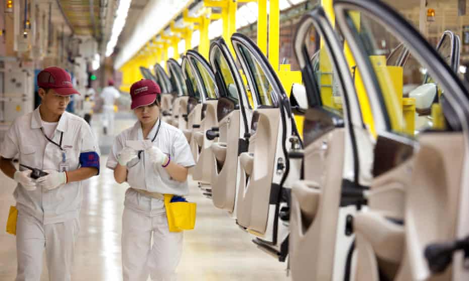 Employees at the Fiat SpA and Guangzhou Automobile Group Co manufacturing plant  in Changsha
