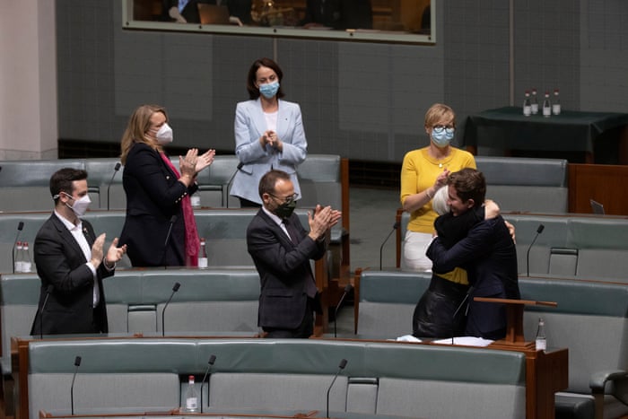 The Greens member for Griffith Max Chandler-Mather is congratulated by his colleagues