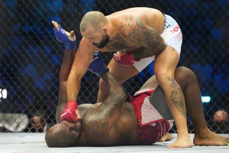 Josh Hokit lands a punch on Derrick Lewis during their heavyweight fight on the White House South Lawn on Sunday night.