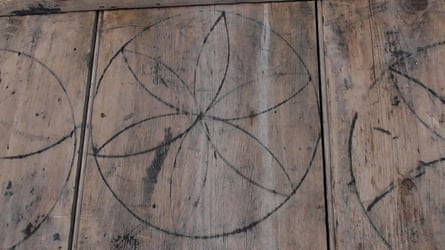 Witches’ marks on a barn door in Laxfield, Suffolk.