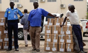 Ad-hoc staff wait to load election materials onto a truck for distribution in Yola, in Adamawa State, Nigeria.