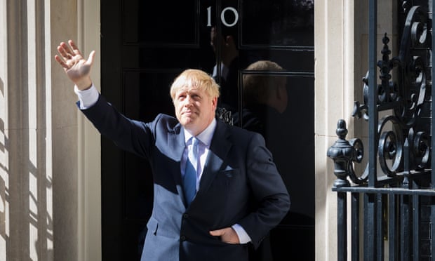 Boris Johnson waves as he enters 10 Downing Street after his appointment, 24 July 2019.