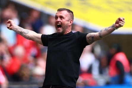 The Charlton manager, Nathan Jones, celebrates after Macaulay Gillesphey’s goal against Leyton Orient.