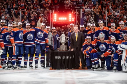 The Edmonton Oilers stand with the Campbell Conference bowl after beating the Dallas Stars in Game 6 of the Western Conference finals.