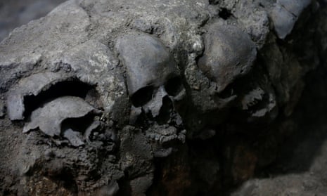 Skulls are seen at a site where more than 650, caked in lime, and thousands of fragments were found in a cylindrical edifice near Templo Mayor, in Mexico City.