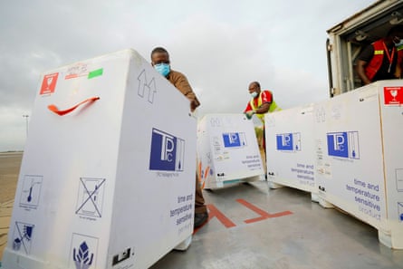Airport workers in Ghana load a lorry with 350,000 AstraZeneca doses in May