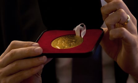 Alessio Figalli, one of the four winners, shows his Fields medal during a press conference in Rio de Janeiro on 1 August.