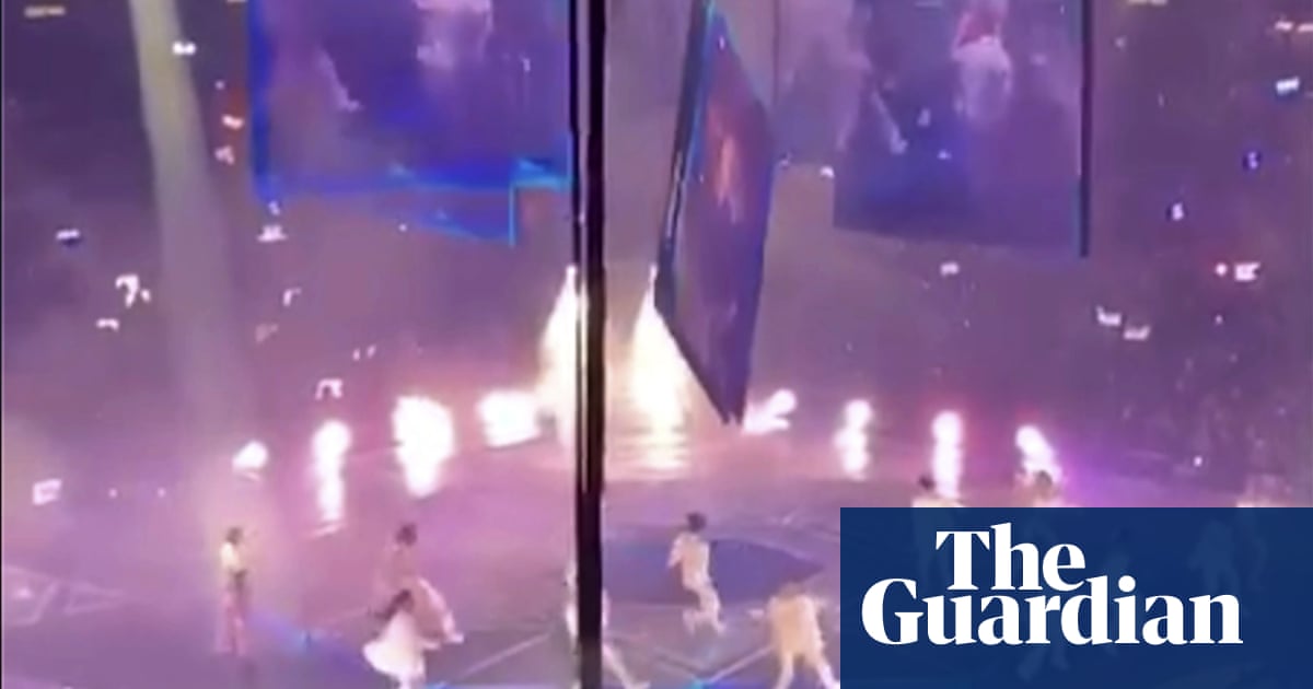 Horror at Hong Kong boyband concert as huge video screen falls on to performers