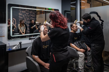 Two Japanese patients undergo preparation for hair transplants