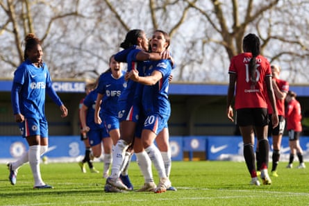 Naomi Girma gets a hug from Sam Kerr after her goal against Manchester United