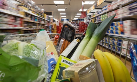 A shopping trolley with groceries in a supermarket