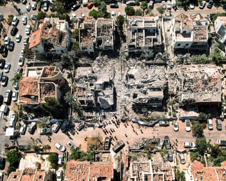 A drone photograph shows damage to homes after a missile attack in Rishon LeZion, Israel.