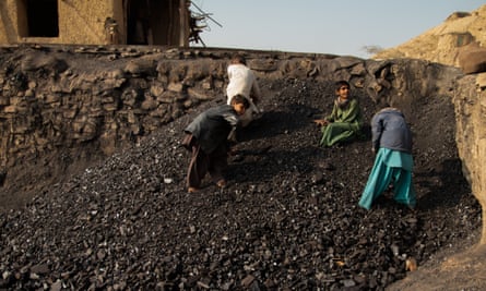 Child labourers sorting coal.