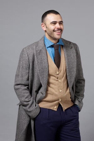 Elgar Johnson wearing coat by Club Monaco, trousers by Oliver Spencer, waistcoat and shirt by Drakes, and tie by Hackett.
