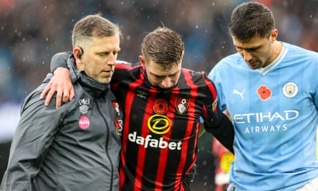 Alex Scott of Bournemouth (centre) was injured at Manchester City last month. Rodri is on the right.
